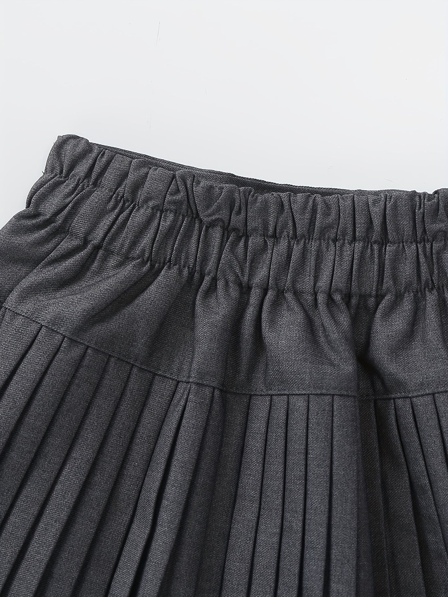 Girls Pleated Mini Skirt - Chic Black Bow-Knot Design, Classic Preppy Style, Solid High Waist, Built-in Safety Shorts, Flattering Mini Length